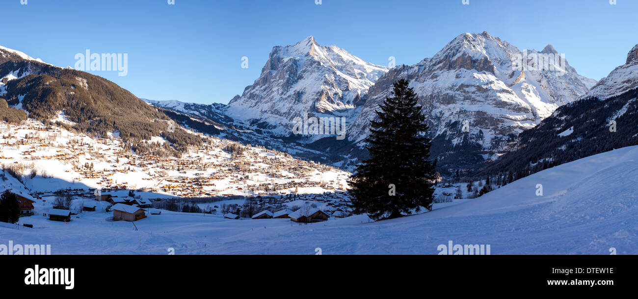 Panoramic view with the town of Grindelwald and surrounding mountains in the Bernese Alps, Switzerland. Stock Photo