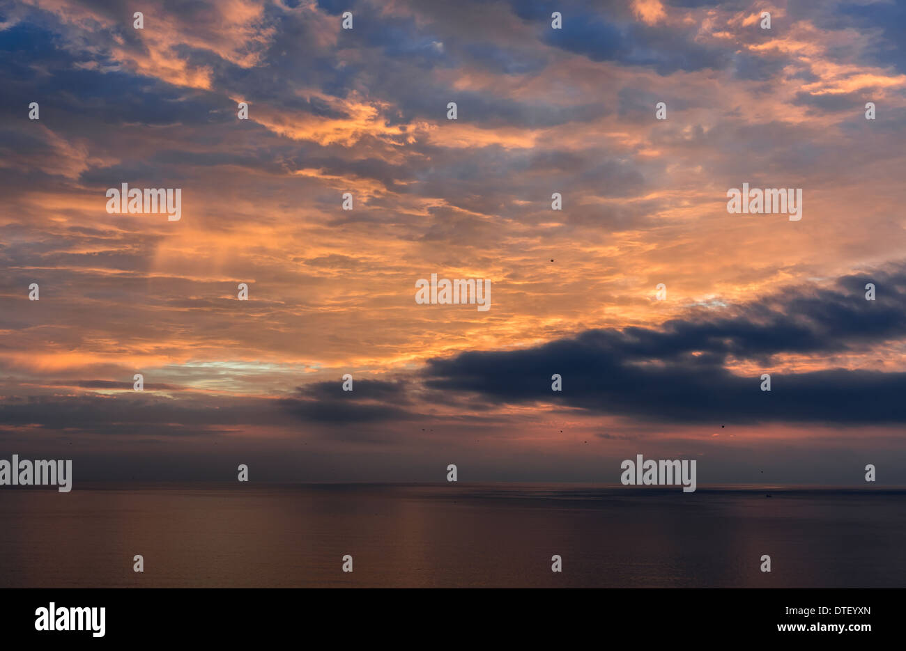 Sea sunset landscape of sun above ocean with clouds hi-res stock ...