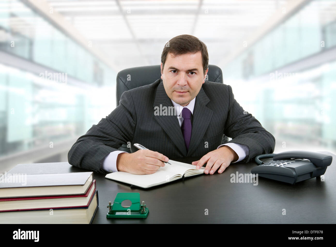 businessman writing on a desk at the office Stock Photo - Alamy