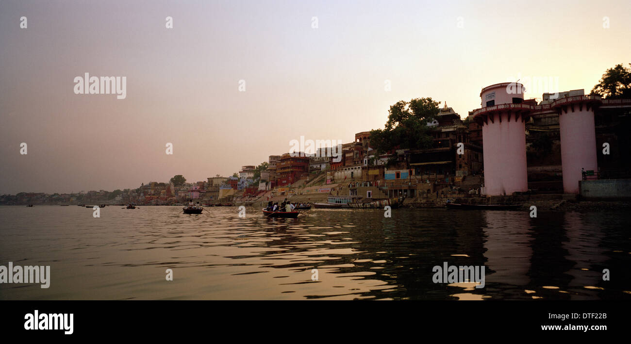 Boat sailing the River Ganges at Varanasi Benares in Uttar Pradesh in India in South Asia. Sail Landscape Serenity Tranquillity Boating Travel Stock Photo