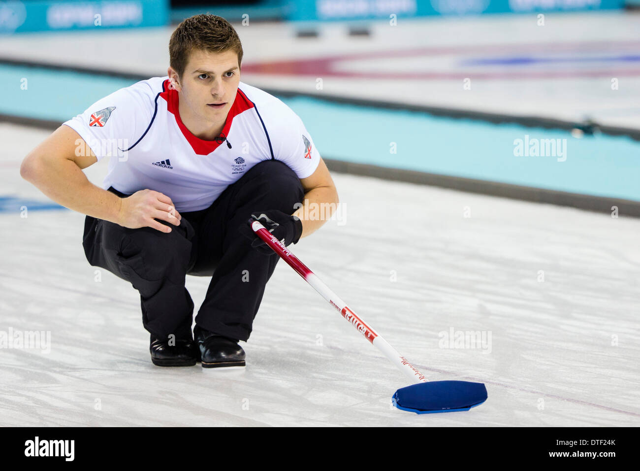 Sochi, Krasnodar Krai, Russia. 17th Feb, 2014. Scott ANDREWS (GBR) during Session 12 of the Round Robin stage of the Men's Curling competition in a match between Great Britain and China, from the Ice Cube Curling Center, Coastal Cluster - XXII Olympic Winter Games Credit:  Action Plus Sports/Alamy Live News Stock Photo