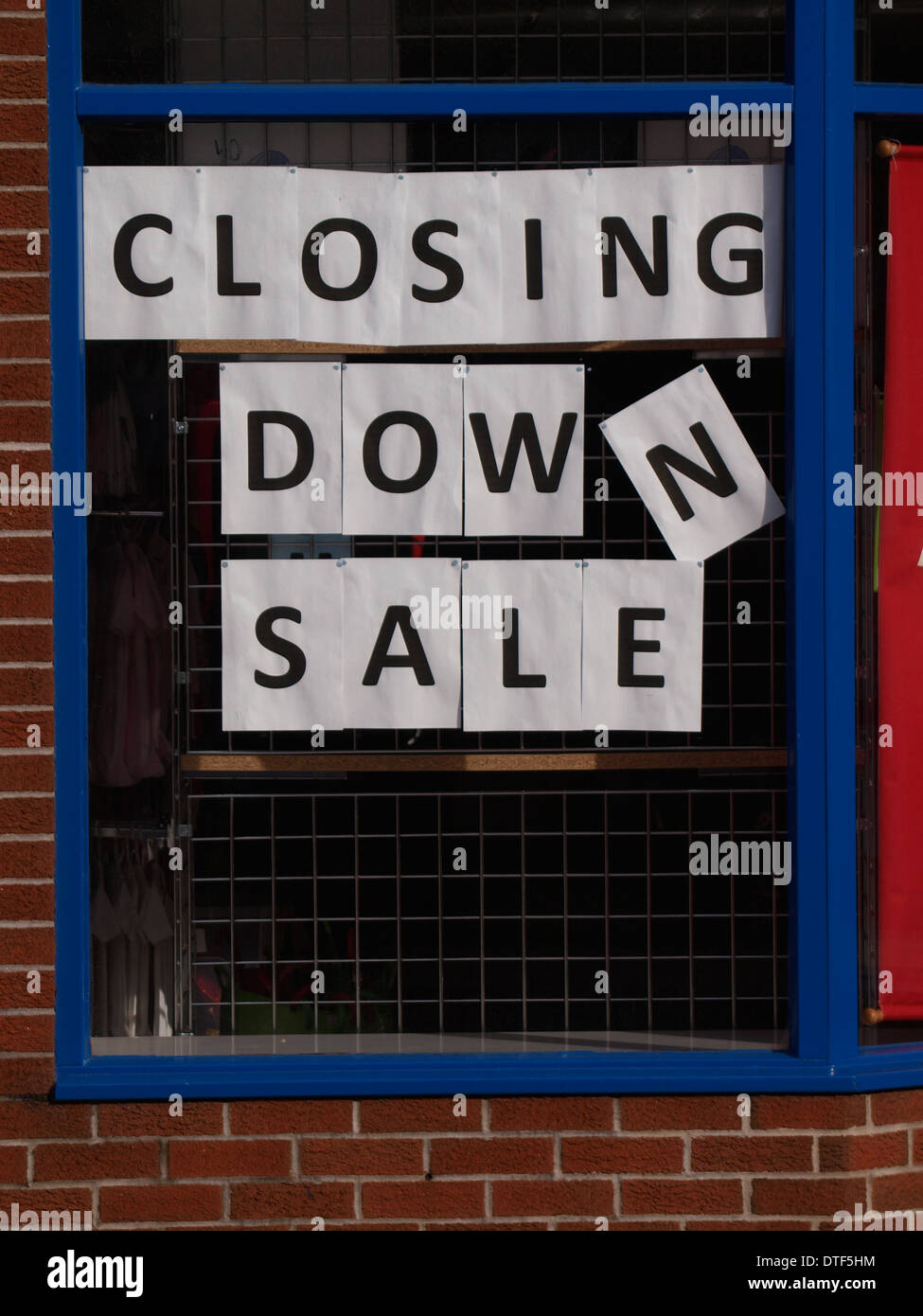 Closing down sale sign in a shop window Stock Photo