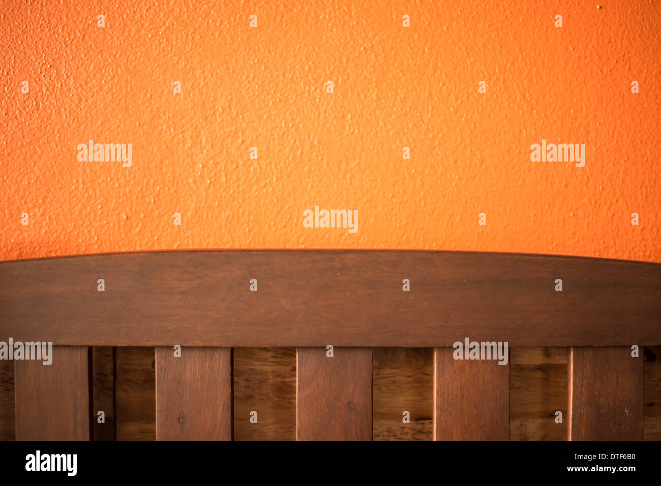 Backrest chair on the orange background in café. Stock Photo