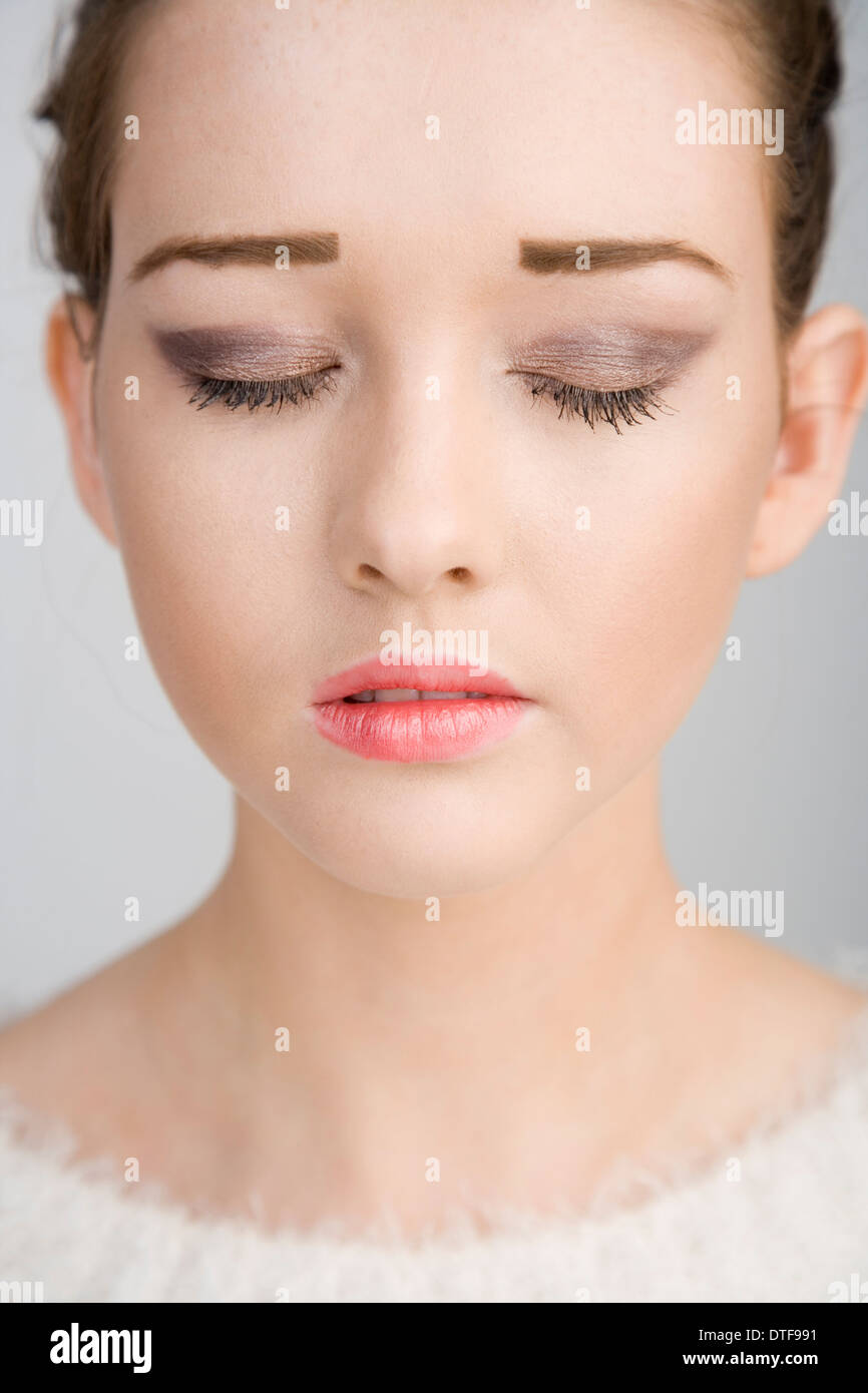 A pretty teenage girl with her eyes closed Stock Photo - Alamy