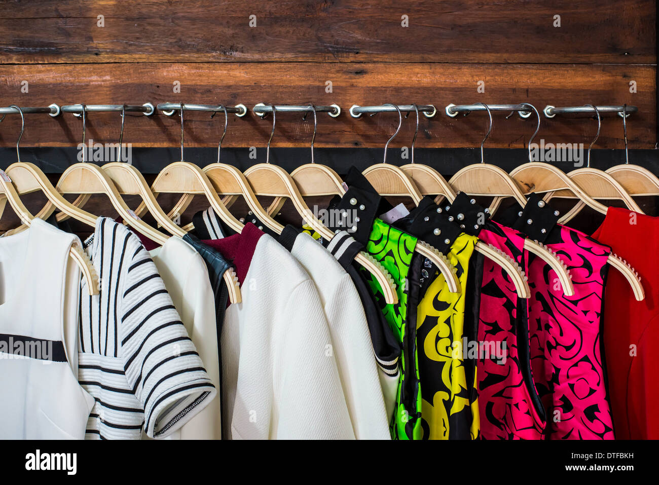 https://c8.alamy.com/comp/DTFBKH/many-blouses-on-hangers-in-the-dressing-room-DTFBKH.jpg