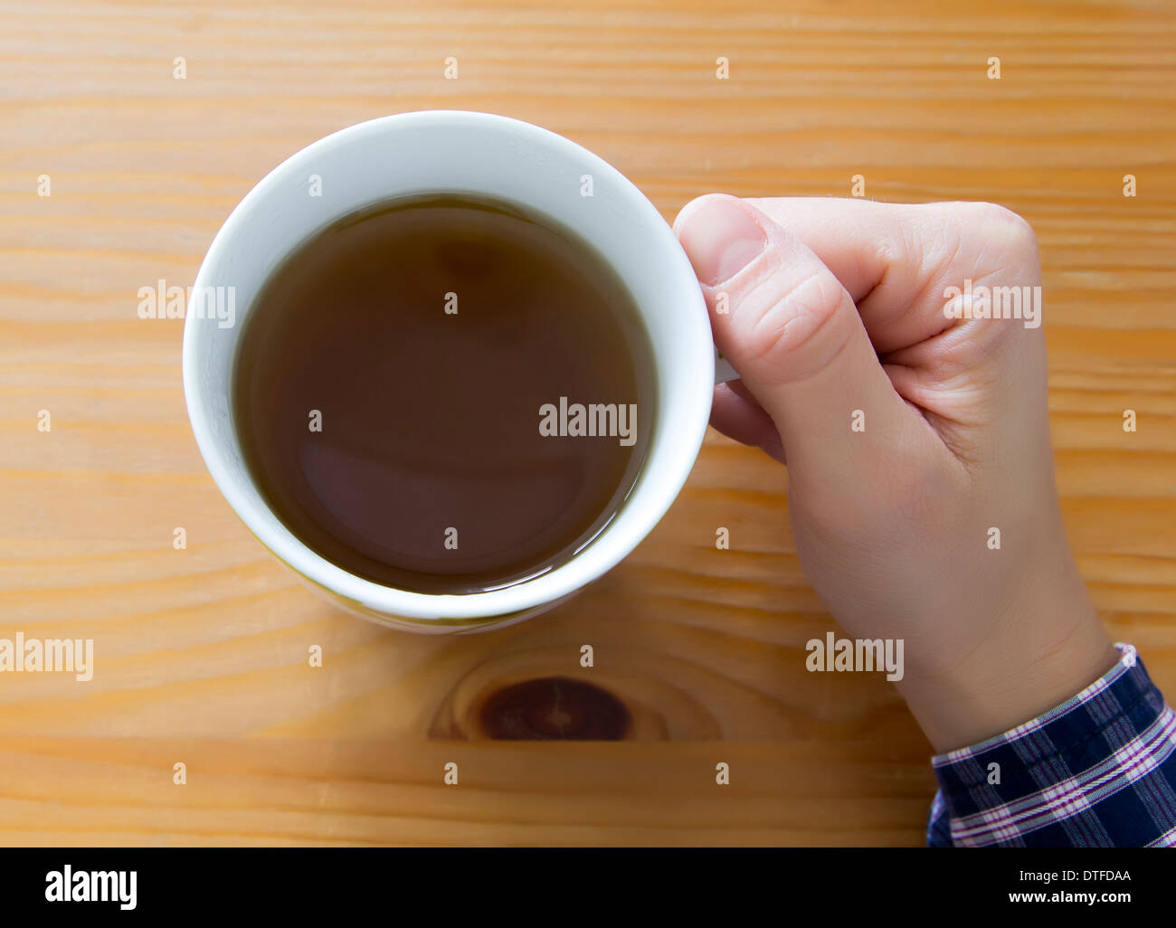 female hand holding mug with mint tea Stock Photo