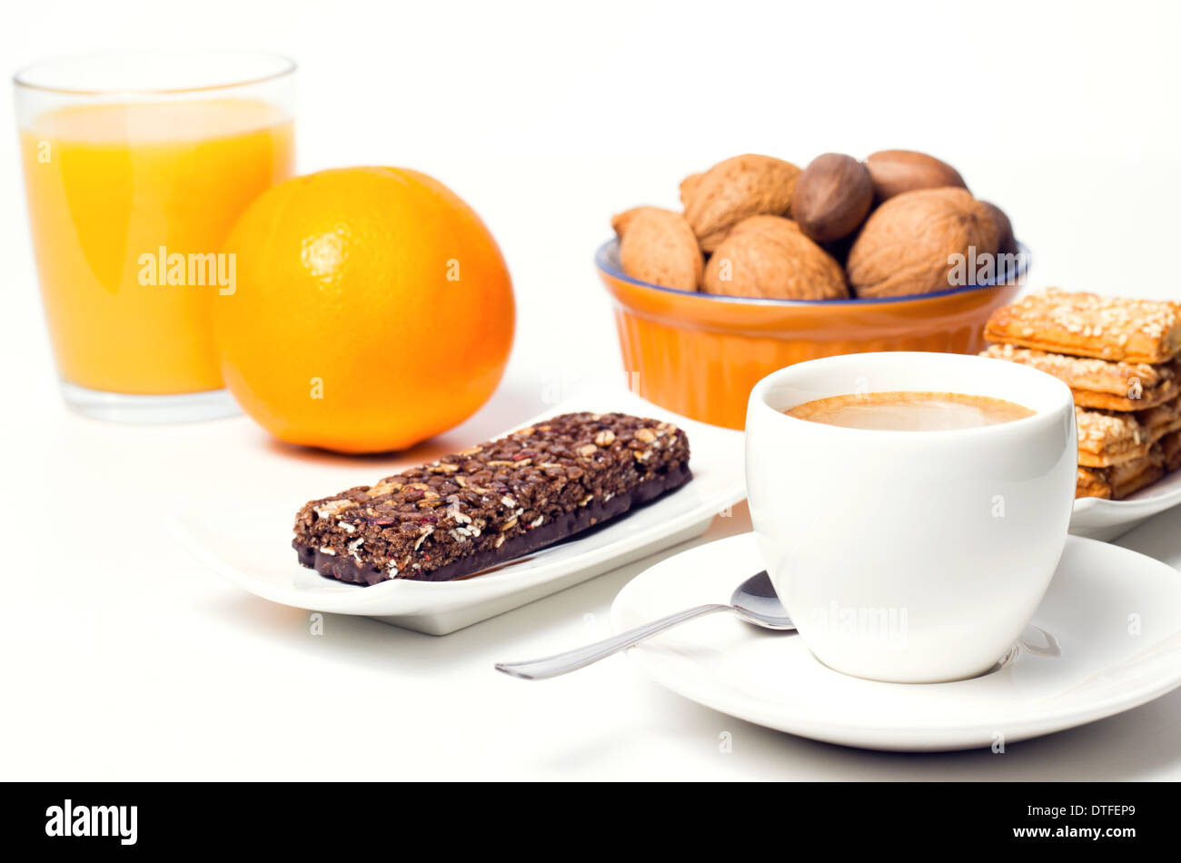 coffee cup with orange natural juice nuts and dessert Stock Photo Alamy