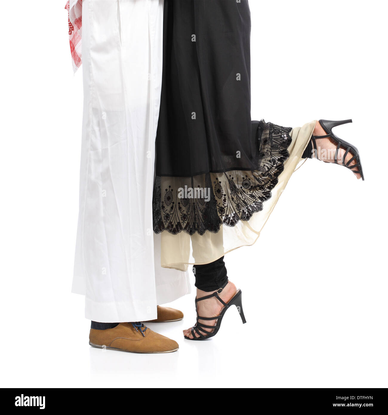 Arab saudi emirates couple legs hugging isolated on a white background Stock Photo