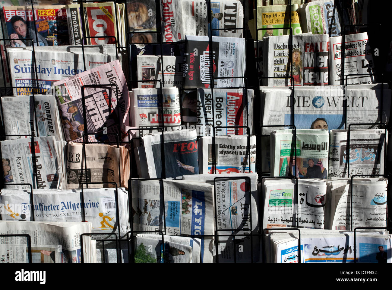 Foreign newspapers on sale in Central London Stock Photo