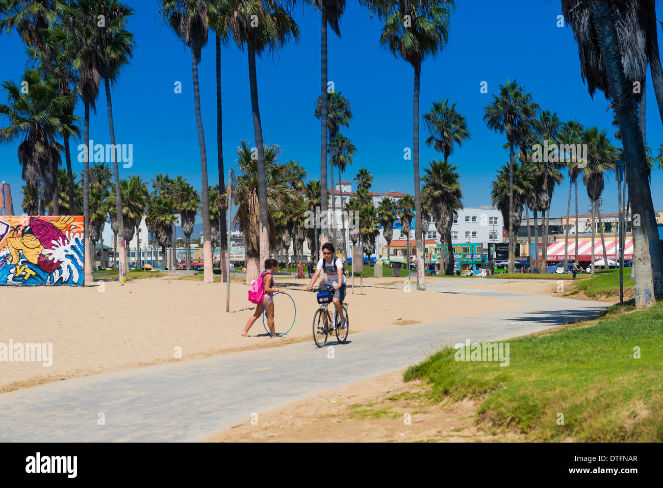 Boy on a bike In Venice Beach, Los Angeles, California Stock Photo