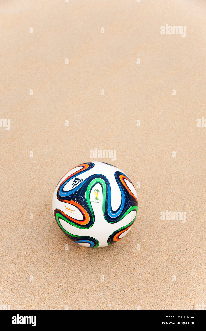 Brazuca (Replica), official matchball of FIFA World Cup 2014 in the sand Stock Photo