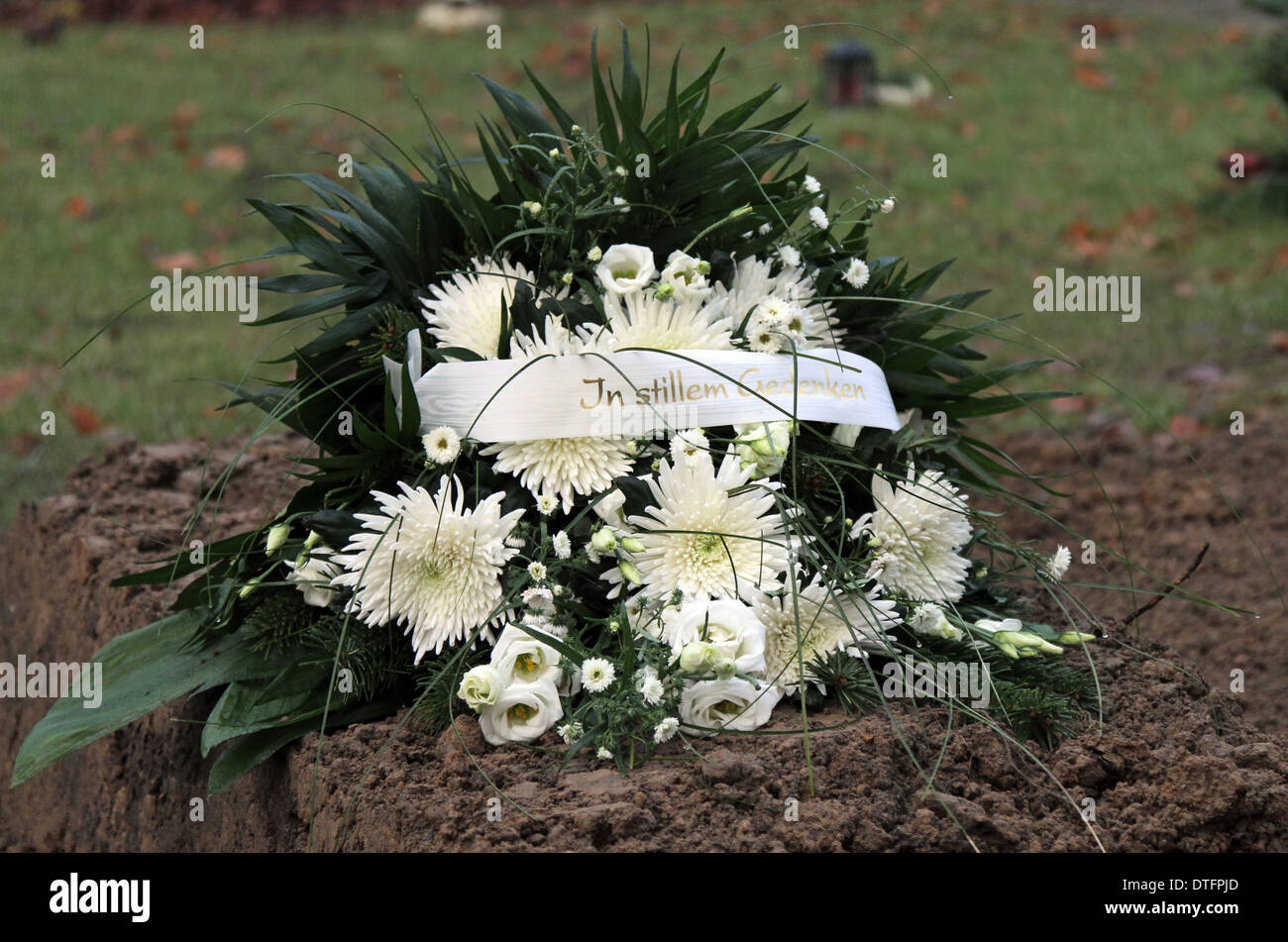 Berlin, Germany, floral arrangement on a newly created grave Stock Photo