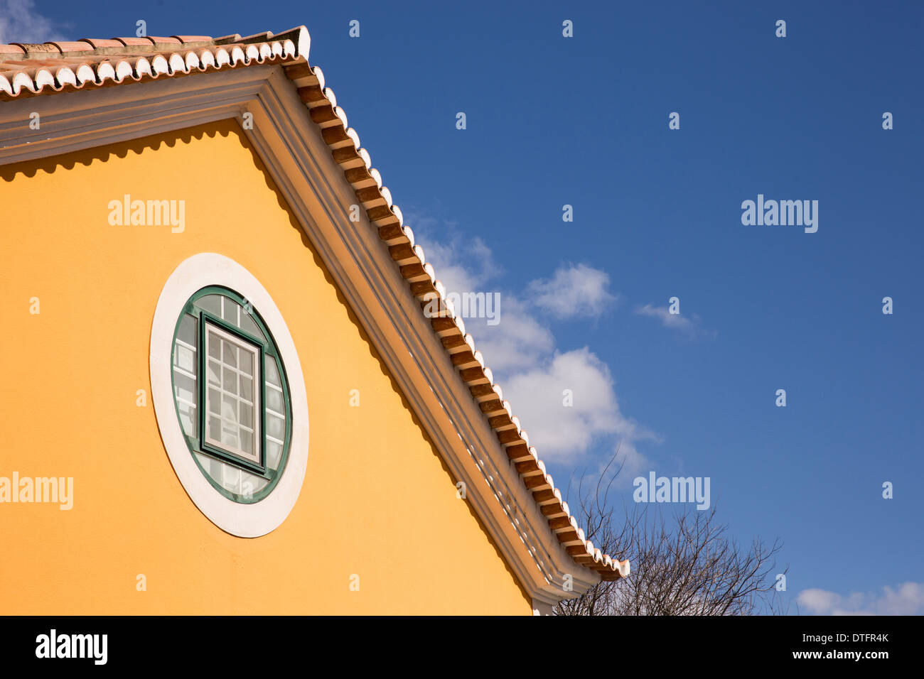 yellow house blue sky Stock Photo