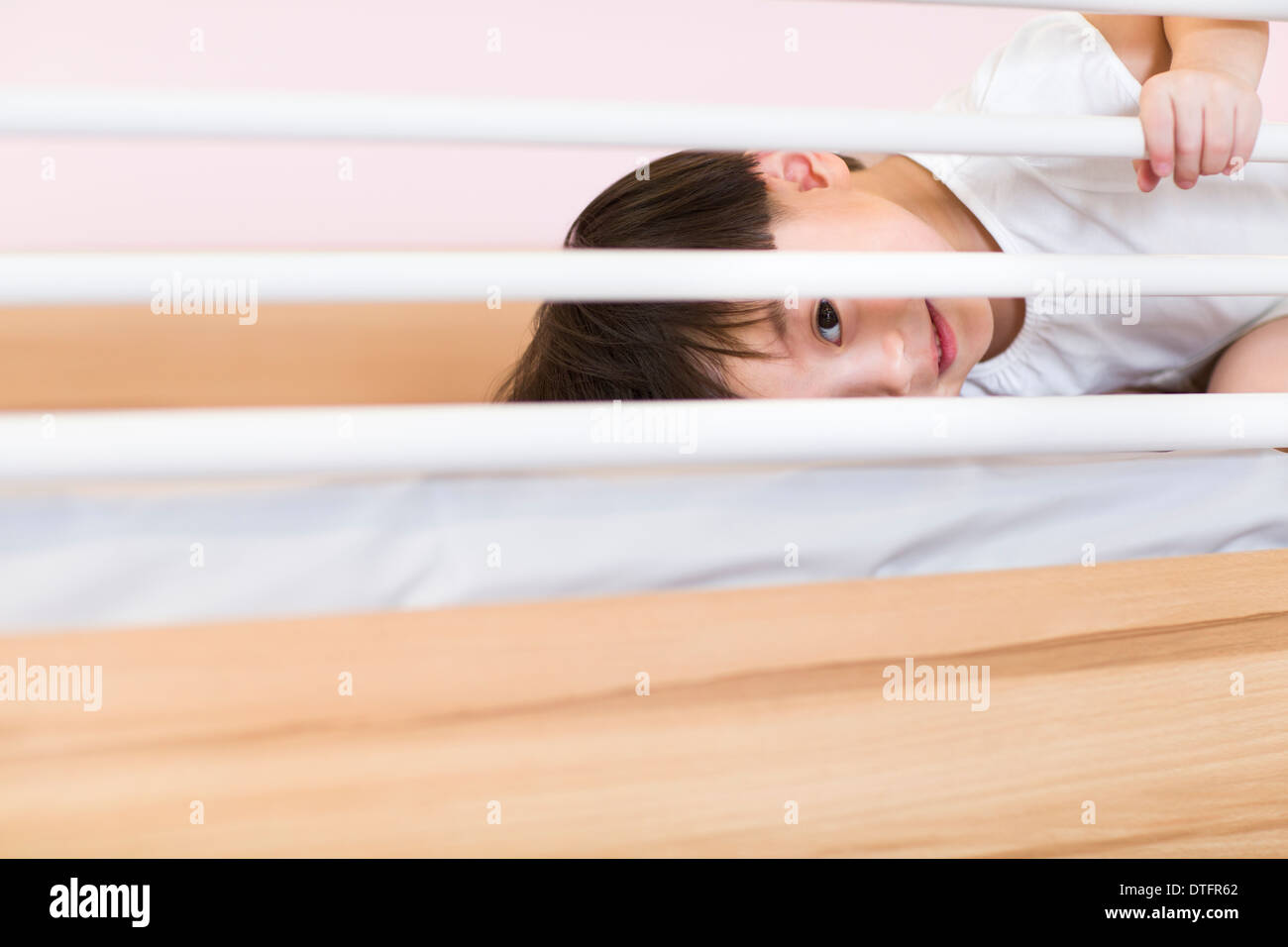 Cute girl lying on bed Stock Photo