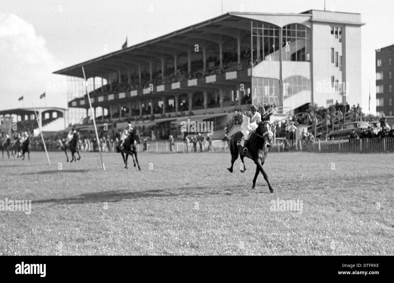 Hamburg, Germany, horses and jockeys in front of the grandstand the racecourse Stock Photo