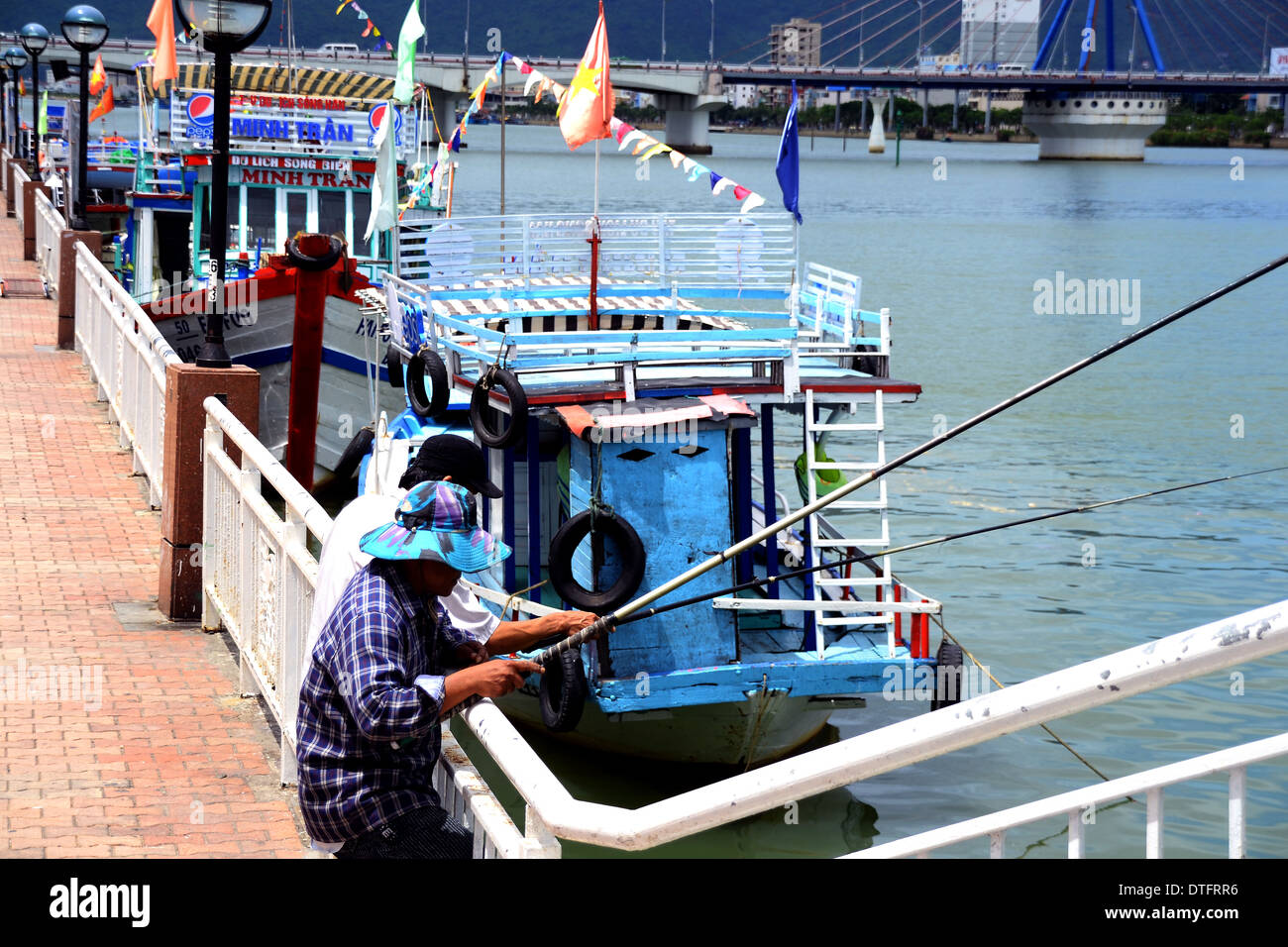 fishermen fishing at Han River in Danang Vietnam Stock Photo