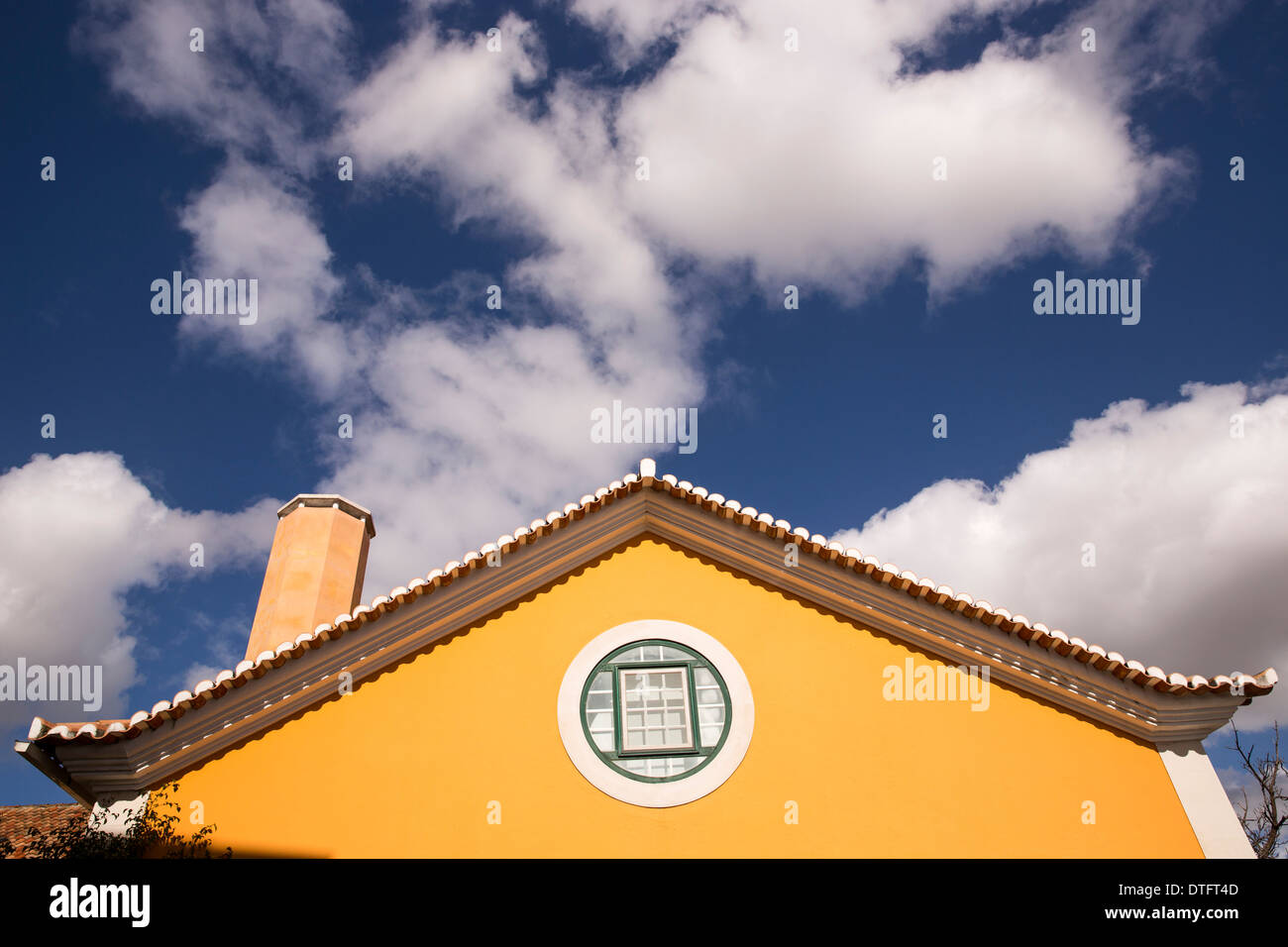yellow house blue sky Stock Photo