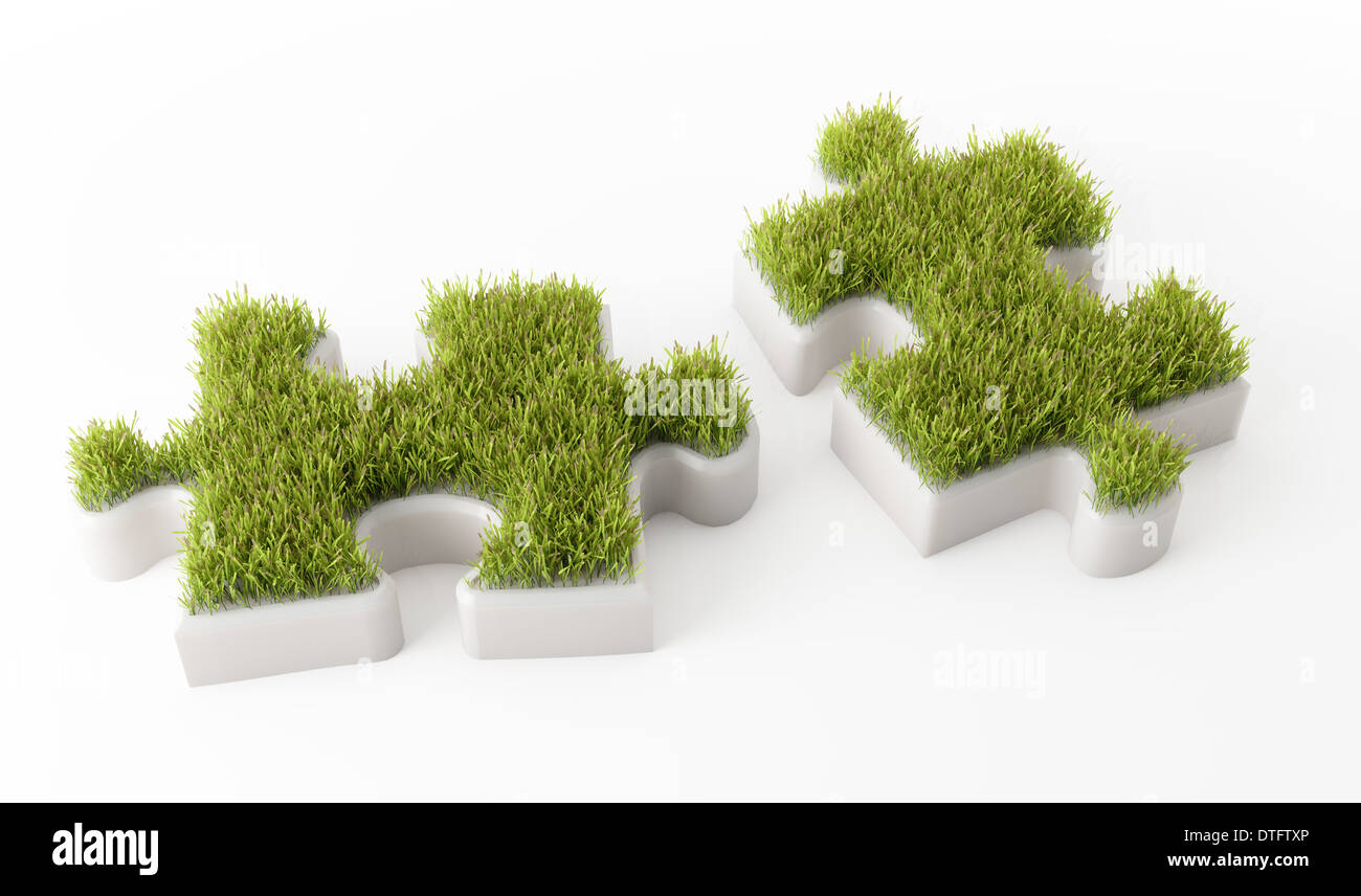 Grass covered puzzle pieces ecology development concept Stock Photo