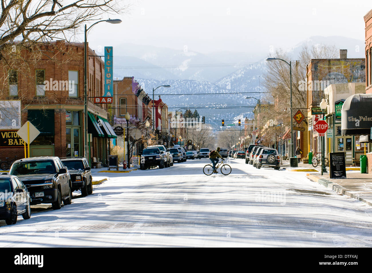 Winter view of F Street & cyclist in historic downtown district, small mountain town of Salida, Colorado, USA Stock Photo