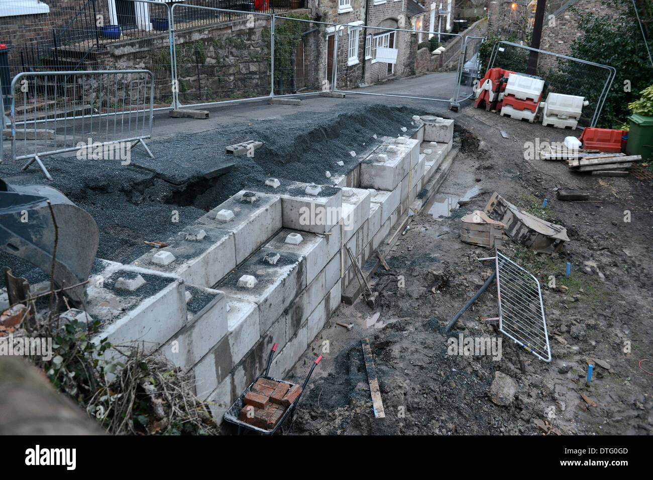 Retaining wall under construction with concrete lego blocks Uk Stock