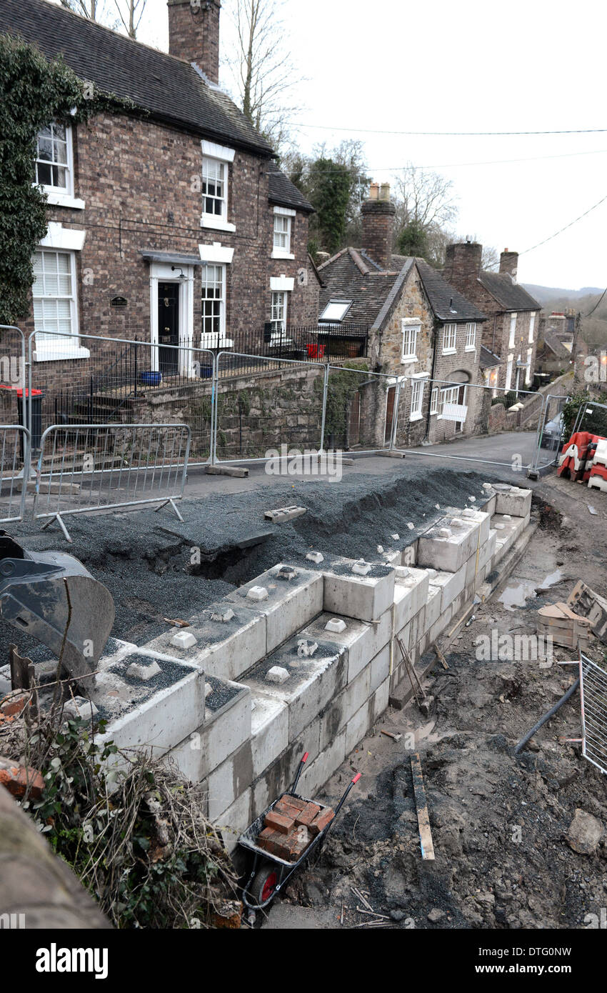 Retaining wall under construction with concrete lego blocks Uk Stock Photo