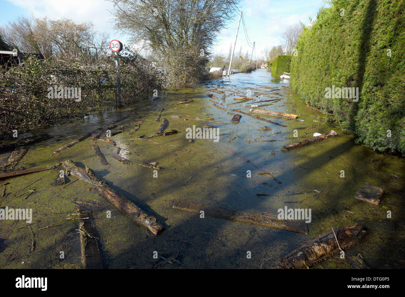 Flooded road in the village of Burrowbridge on the Somerset Levels February 2014 Stock Photo