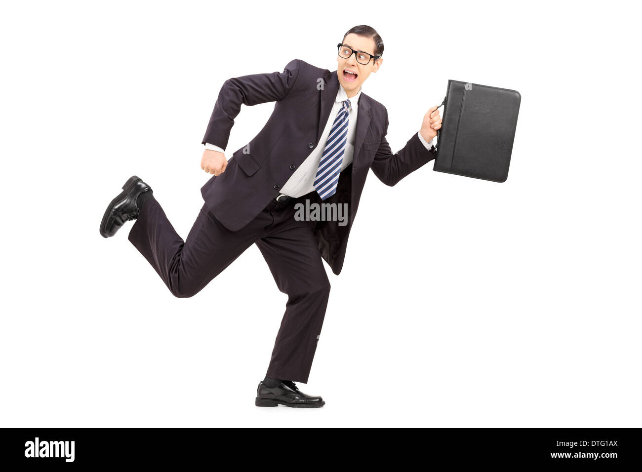 Scared male businessman running away from something Stock Photo - Alamy
