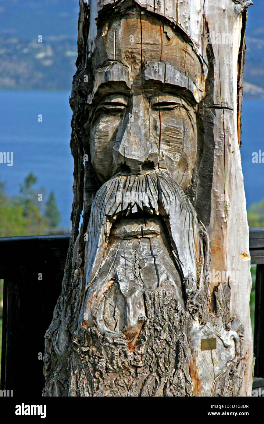 Giant Wooden Carving /Sculpture on the Shores of Okanagan Lake BC Canada Stock Photo