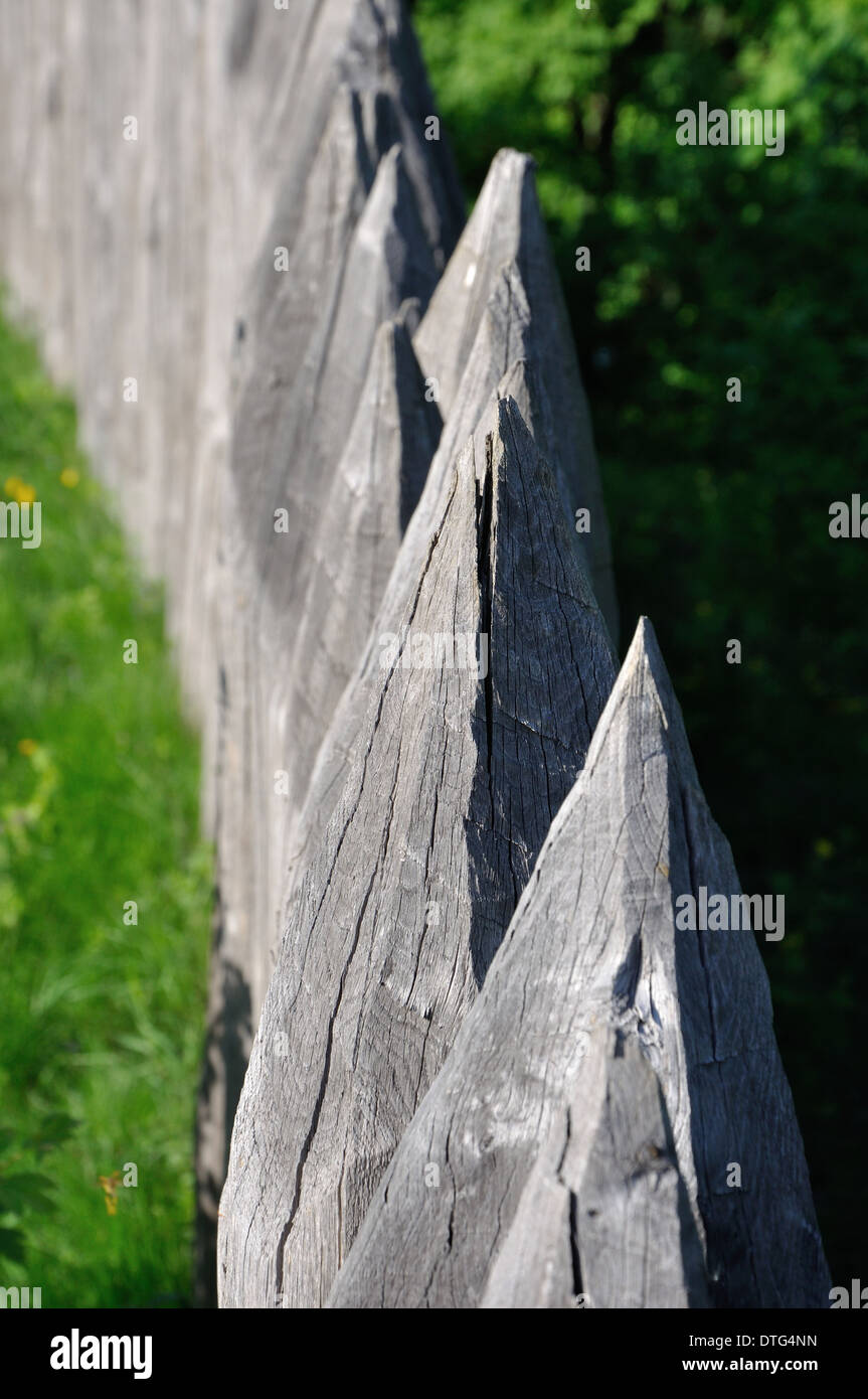 sharp wooden paling as part of old fort fence Stock Photo