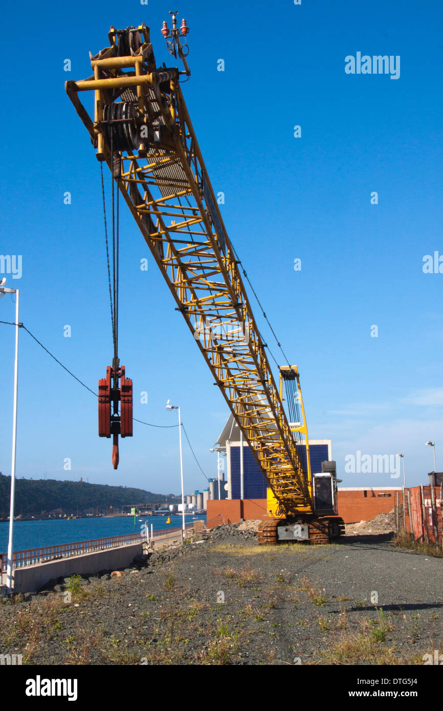 Idle mobile crane on construction site at entrance to harbor in Durban