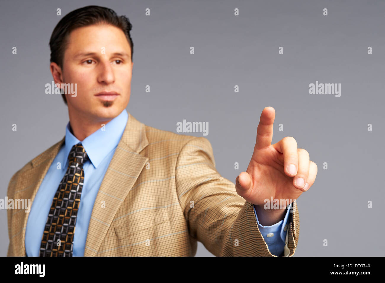 Businessman touching digital screen Stock Photo