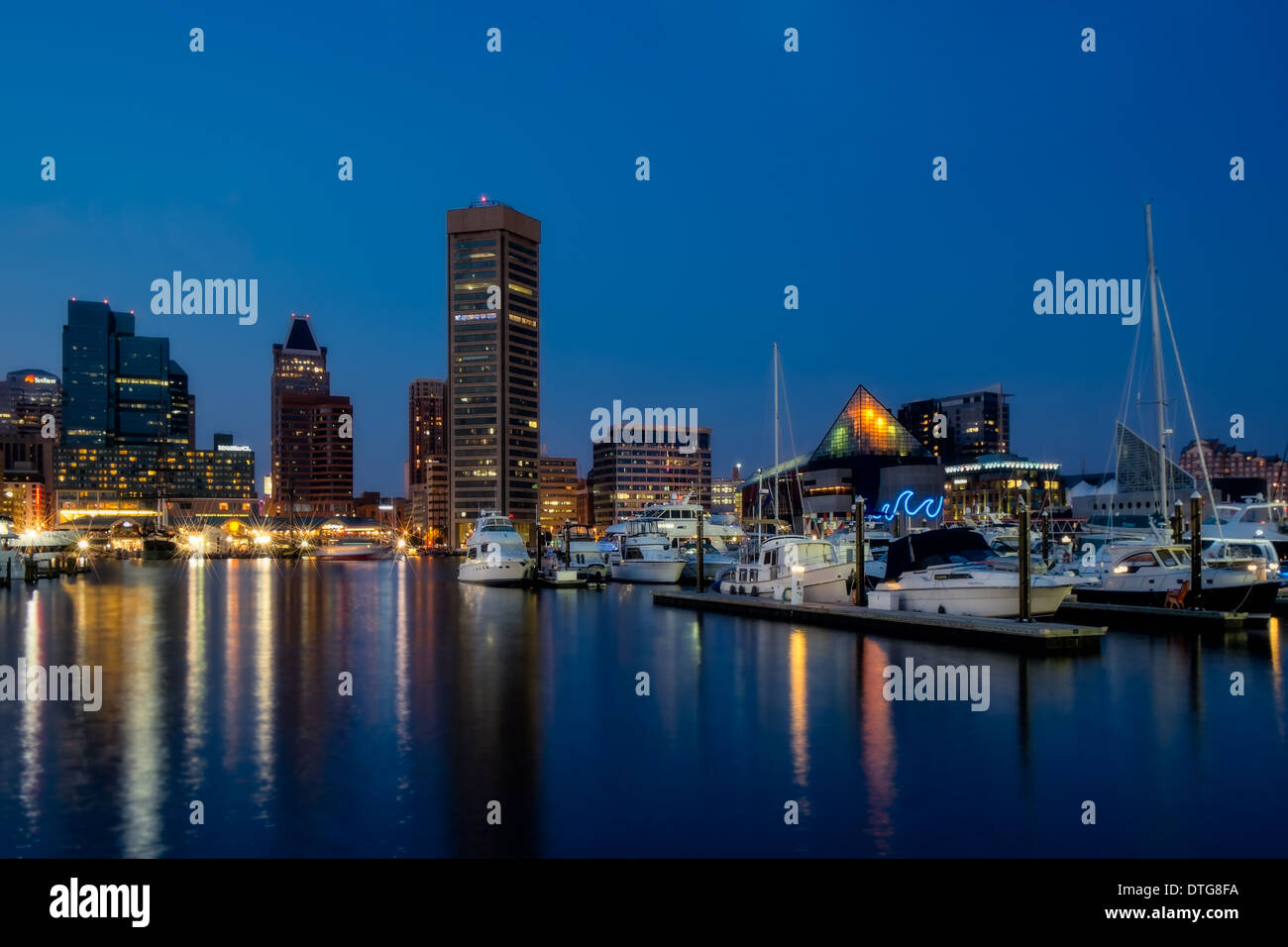 Baltimore Inner Harbor Skyline and refections in the water during the twilight hour after sunset. Stock Photo