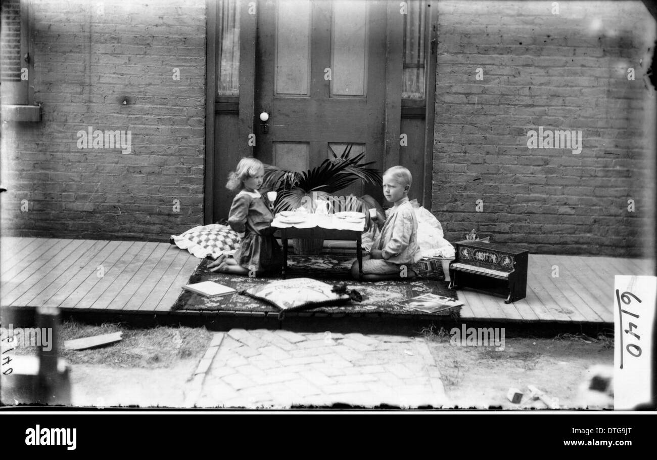 Boy girl playing tea party hi-res stock photography and images - Alamy