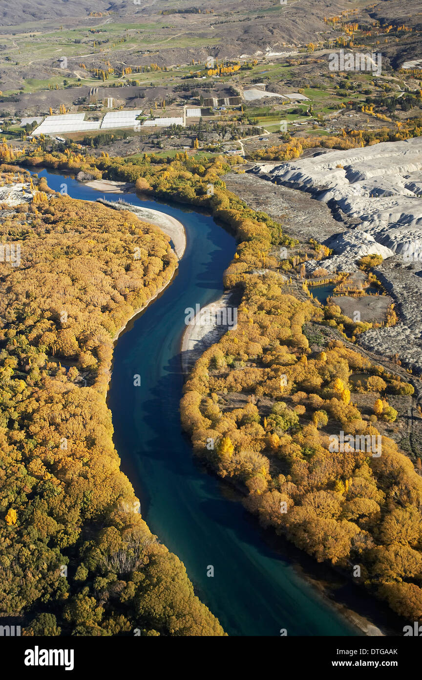 Clutha River, Autumn Colour and Earnscleugh Historic Gold Dredge Tailings, Central Otago, South Island, New Zealand - aerial Stock Photo