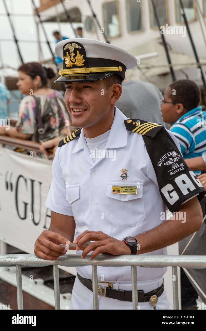 Marine Officer F. Hermenejildo from Ecuador, Buque Escuela Guayas Tall ship, holds an ID card in his hands while smiling. Stock Photo