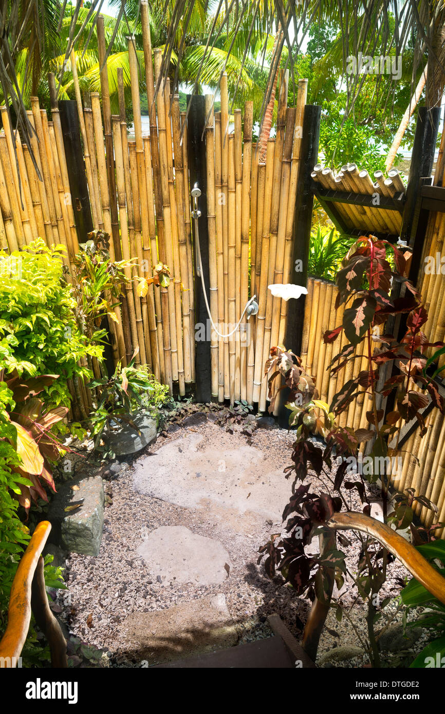 An Exotic Tropical Outdoor Shower Surrounded By Lush Gardens And Bamboo Walls Is Ideal For Resort Living Stock Photo Alamy