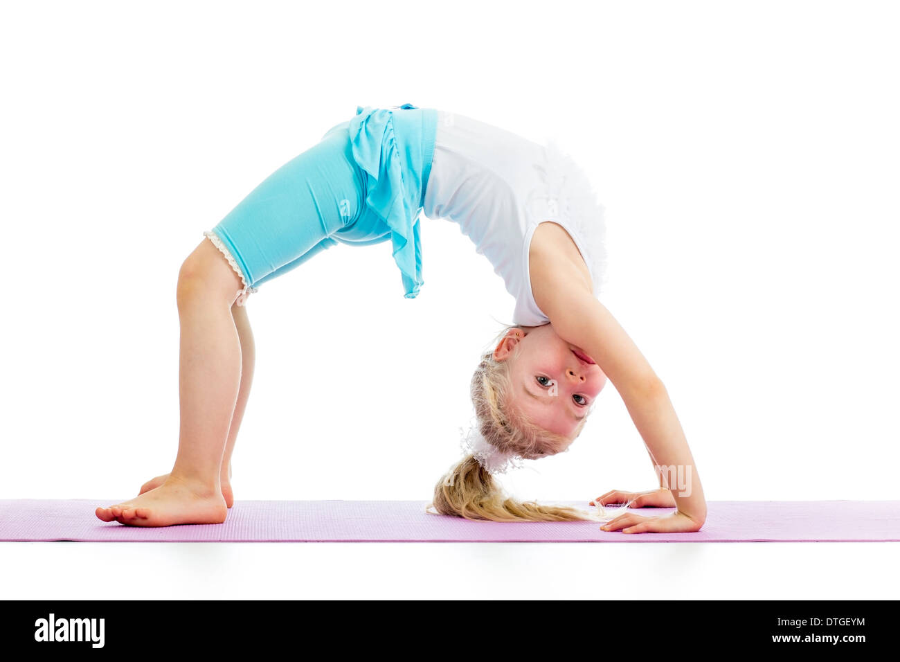Young girl doing gymnastics Stock Photo by ©evdoha 5476252