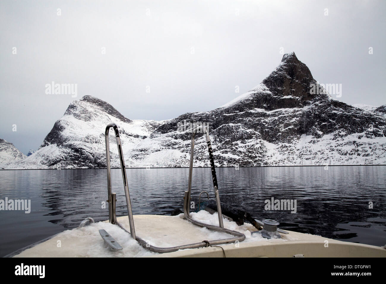 From a trip in the fjords of Greenland. Iceberg and cold water. Rocks