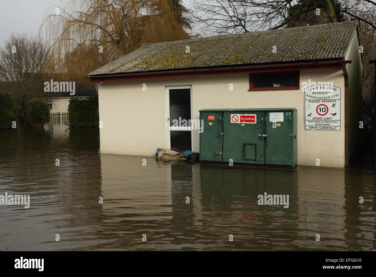 Ham Island, Thames Valley, UK Flood waters surround electricity box. Stock Photo