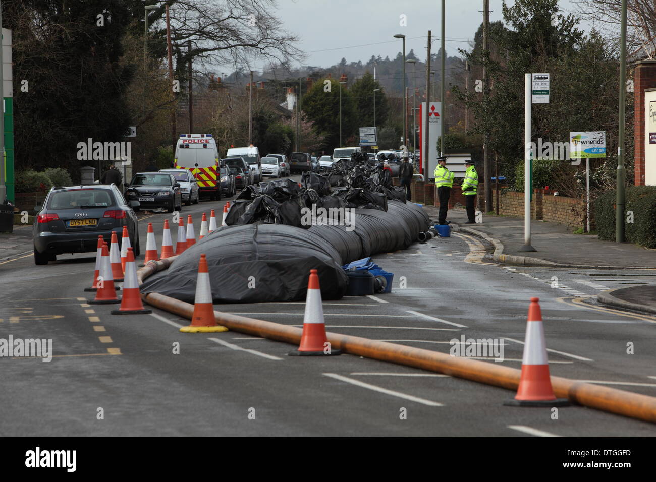 Cherysey Thames Valley, UK . 17th Feb, 2014. The aqua dam know as the 'Chertsey sausage' on Chertsey Bridge road. Flood waters remain high a week after flooding across the Thames valley. UK Credit:  Zute Lightfoot/Alamy Live News Stock Photo