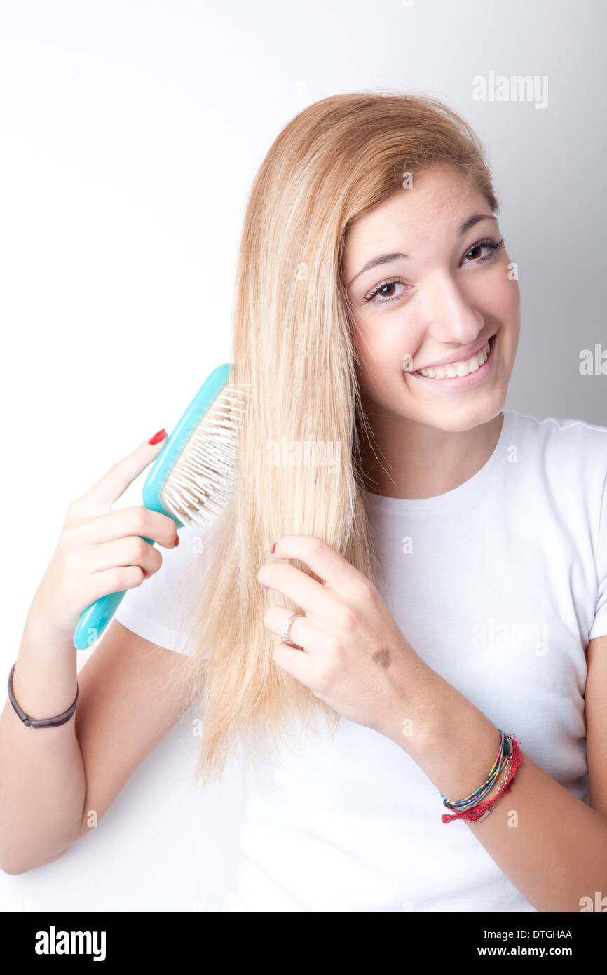 Teenage girl brushing hair hires stock photography and images Alamy
