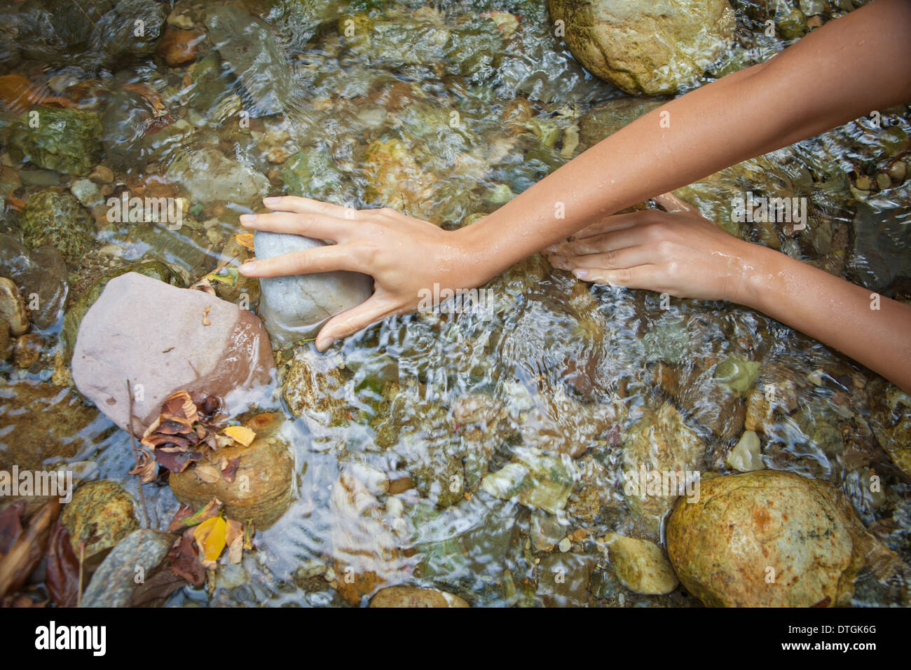 woman's hands in a stream Stock Photo