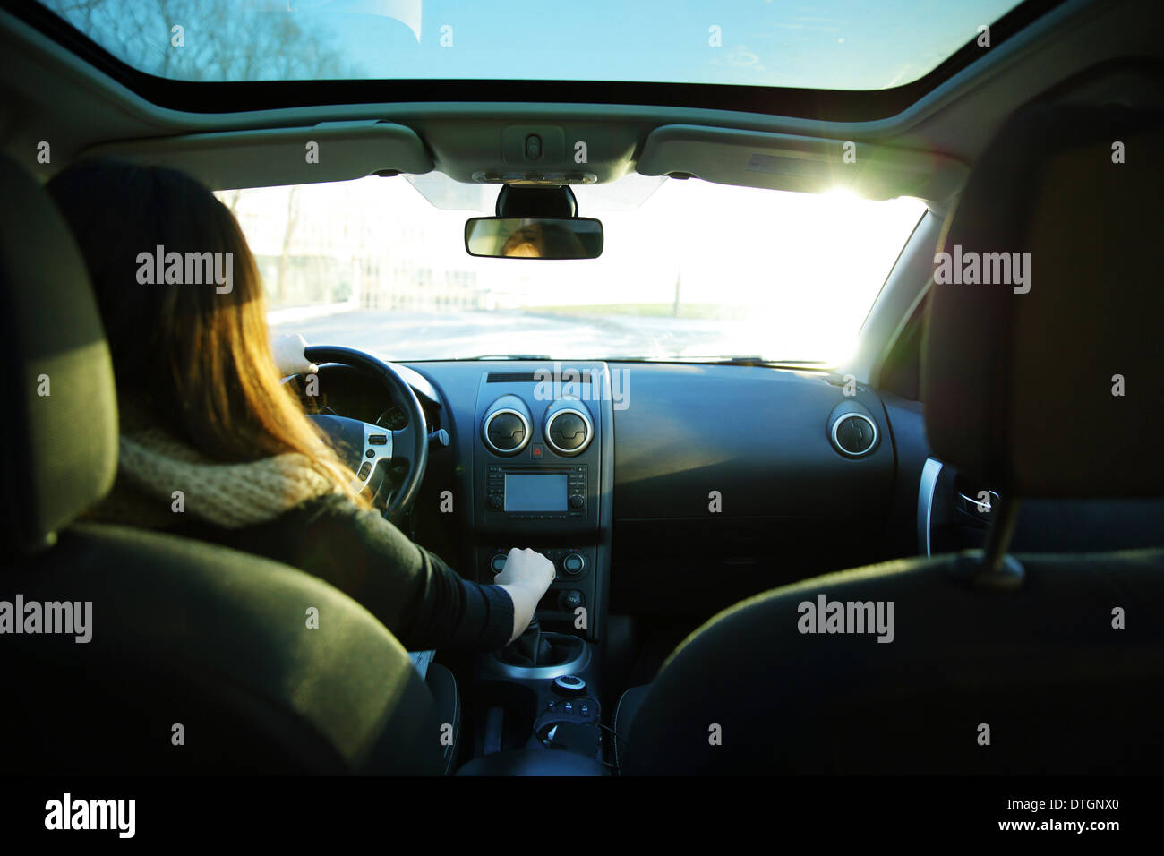 Young Woman Driving A Car View From Backseat Stock Photo Alamy