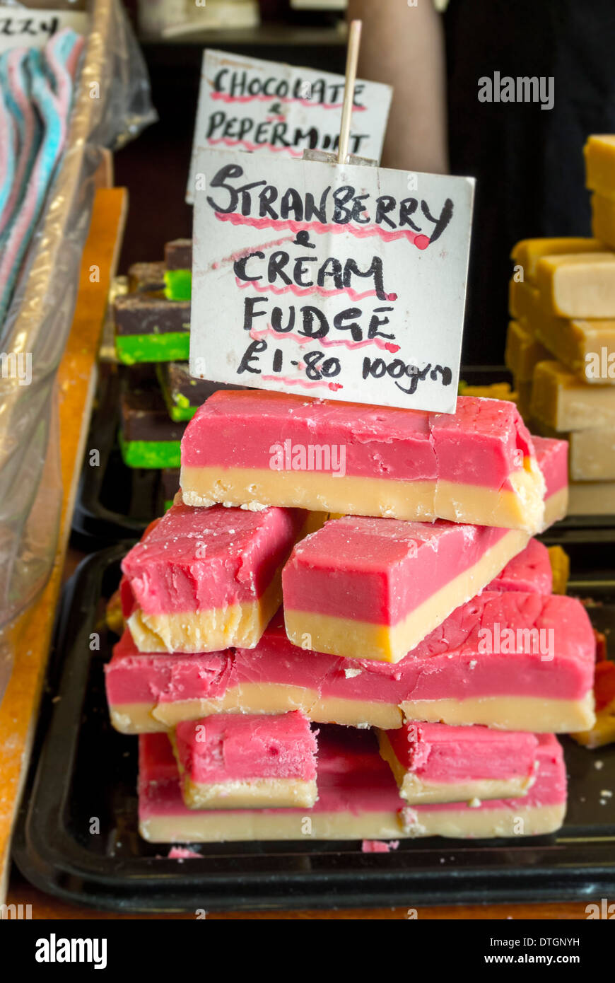 Strawberry cream fudge with sign in sweetshop Stock Photo