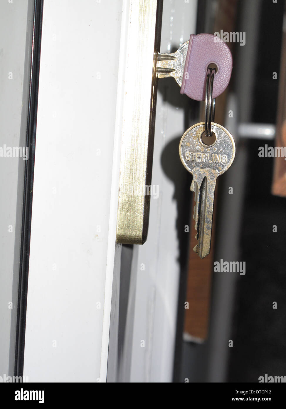 House keys in inside front door lock Stock Photo Alamy