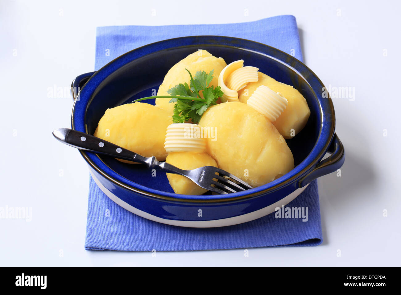 Boiled potatoes with butter and parsley Stock Photo Alamy