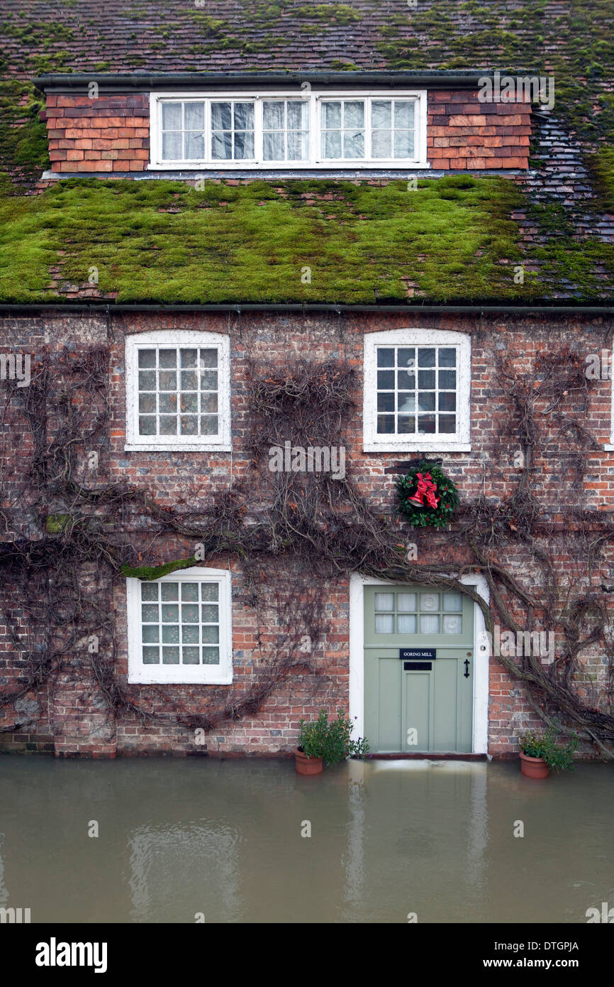 A Victorian Red Brick Water Mill Building With Flood Water