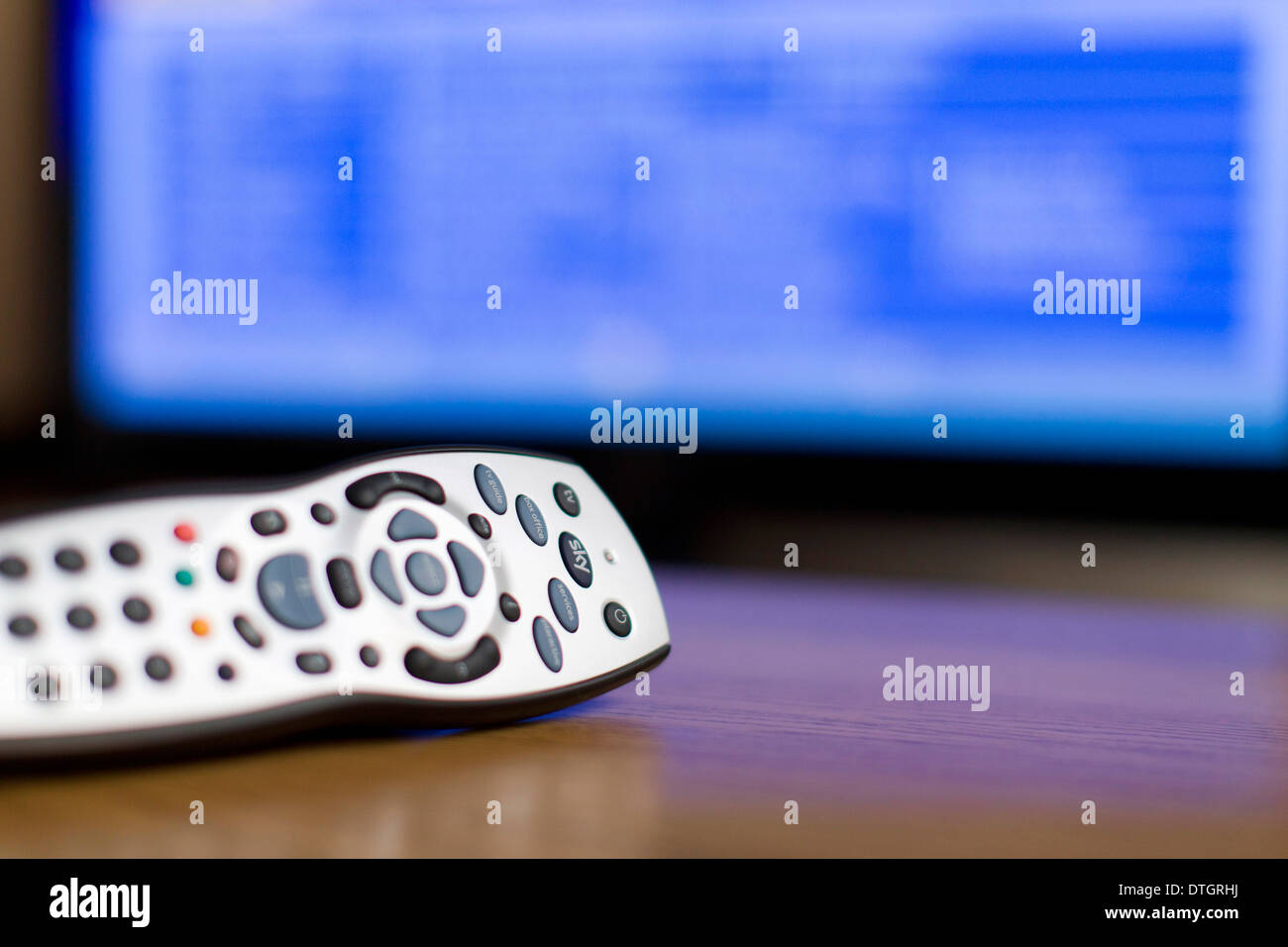 A Sky television remote control is pictured on a table at home. Stock Photo