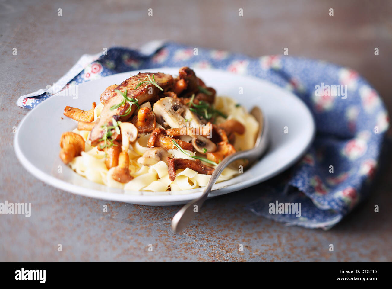 Tagliatelles with mushrooms and foie gras Stock Photo