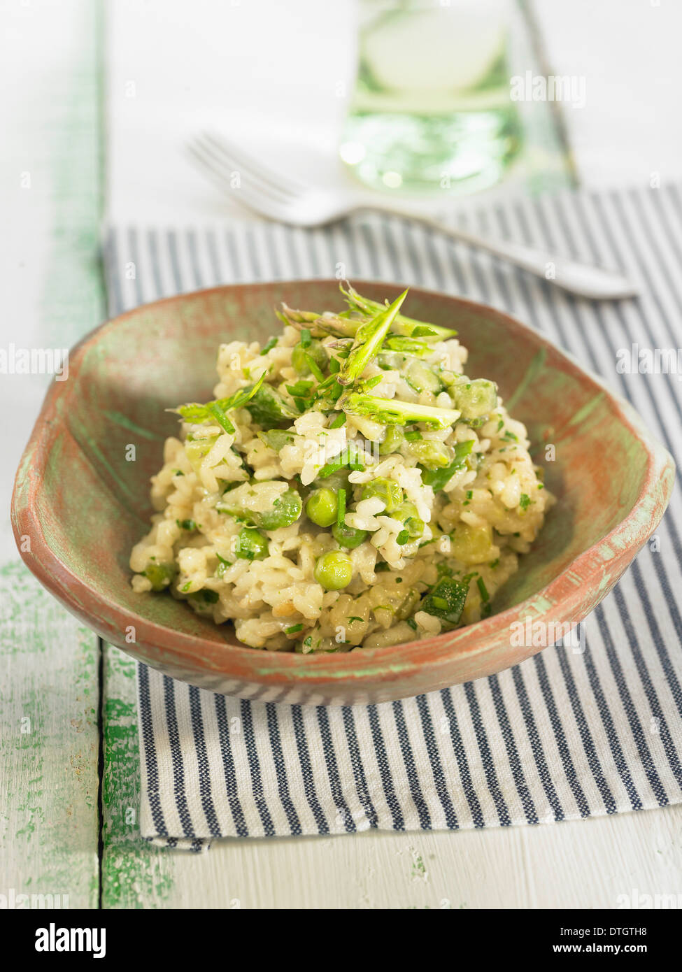 Green risotto with parmesan,celery,fennel and zucchinis Stock Photo
